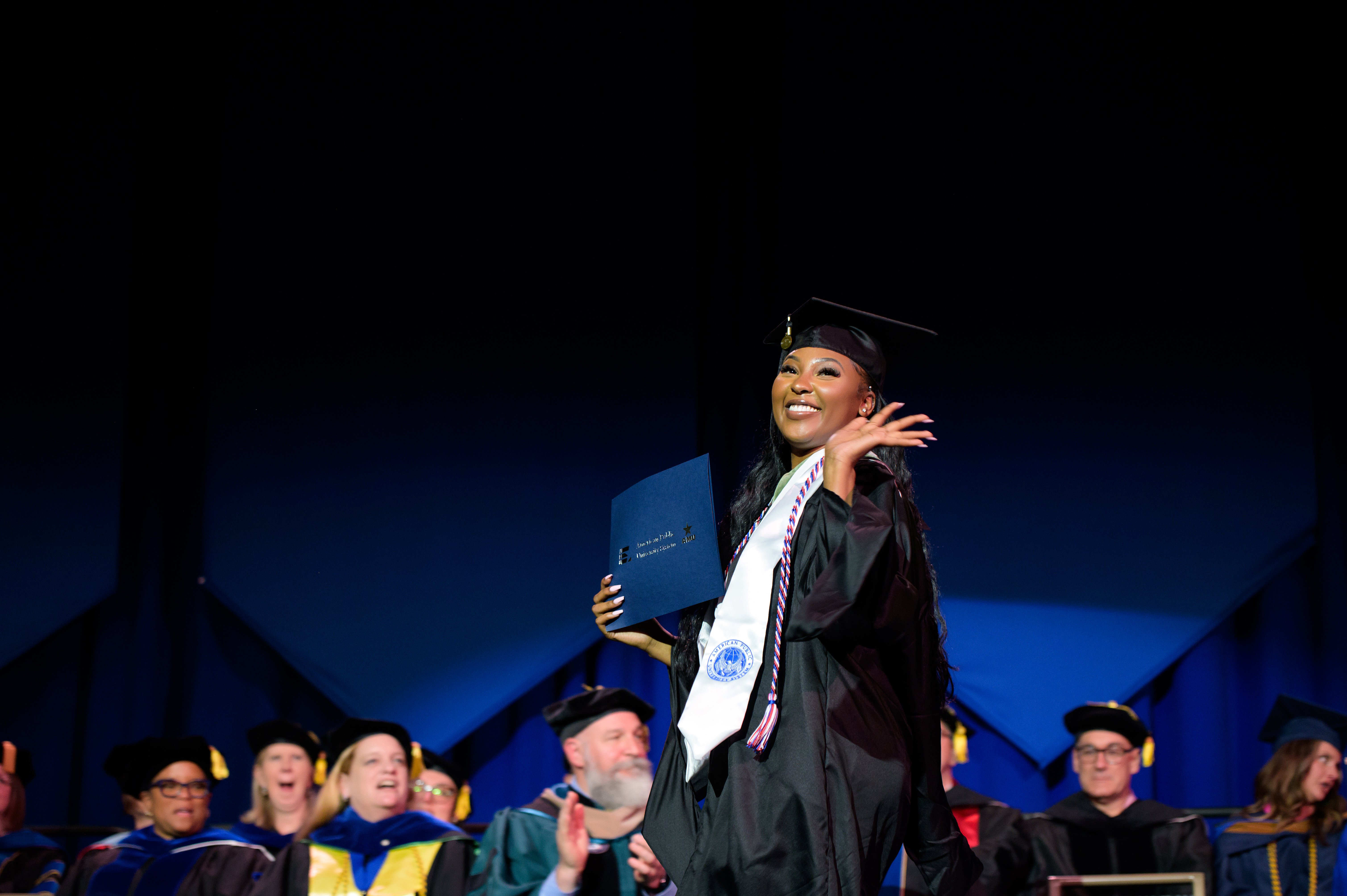 Women Walking Across Stage 